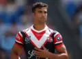 Top NRL Player in the US Changes His Mind, Joins Roosters  In a surprise twist, a high-profile NRL talent based in the United States has reportedly reversed his decision and is now set to join the Sydney Roosters.  Sudden U-Turn  The player had been strongly linked with opportunities in the US — a growing pathway for rugby league as the game expands internationally. But in a dramatic change of direction, he has opted to return to Australia and commit to one of the NRL’s powerhouse clubs.  The decision is believed to have come after:  Ongoing discussions with Roosters officials Re-evaluation of long-term career goals Desire to compete at the highest level consistently Why the Roosters?  The Roosters continue to position themselves as a destination club, offering:  Elite development systems Premiership-contending environment Strong leadership and culture  For any player weighing options, those factors are hard to ignore.  What He Brings  While details are still emerging, the signing is expected to add:  Experience from different competitions Physicality and adaptability Fresh attacking or defensive options depending on position  It’s a move that could strengthen depth and create healthy competition within the squad.  Bigger Picture  This development highlights a growing trend — while rugby league is expanding globally, the pull of the NRL remains strong.  Top players still see Australia as the benchmark for elite competition.  Final Word  A change of heart. A major signing. And another statement from the Roosters.  If confirmed, this could be one of the more intriguing moves of the season — and one that adds yet another layer to Sydney’s premiership ambitions.